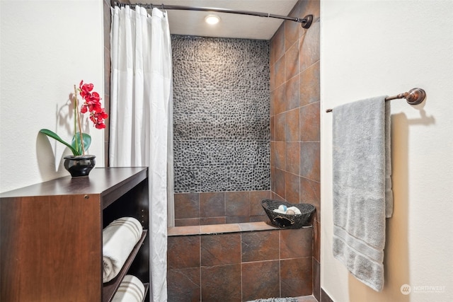 bathroom featuring a shower with curtain