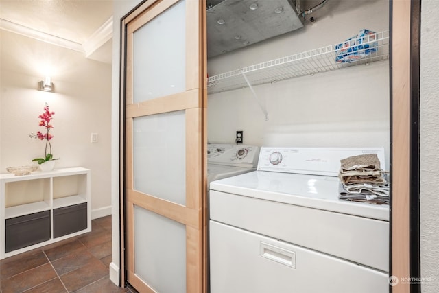 laundry room featuring ornamental molding and washing machine and dryer