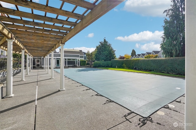 view of swimming pool featuring a patio and a pergola