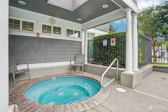 view of pool featuring a community hot tub