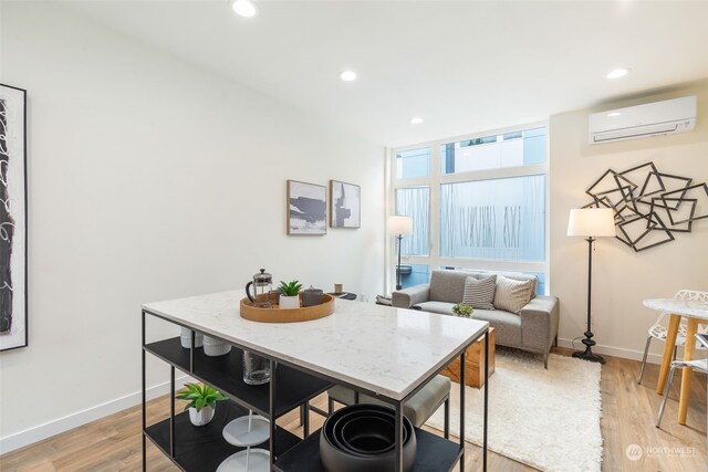 1325 NW 85th St, Seattle, WA 98117 - dining space with light wood-type flooring and an AC wall unit