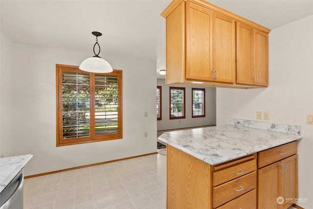 kitchen featuring stainless steel dishwasher, kitchen peninsula, light stone countertops, and decorative light fixtures