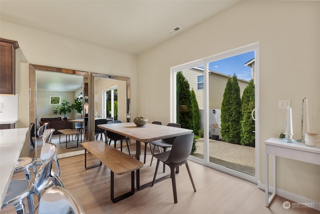 dining area featuring light wood-type flooring