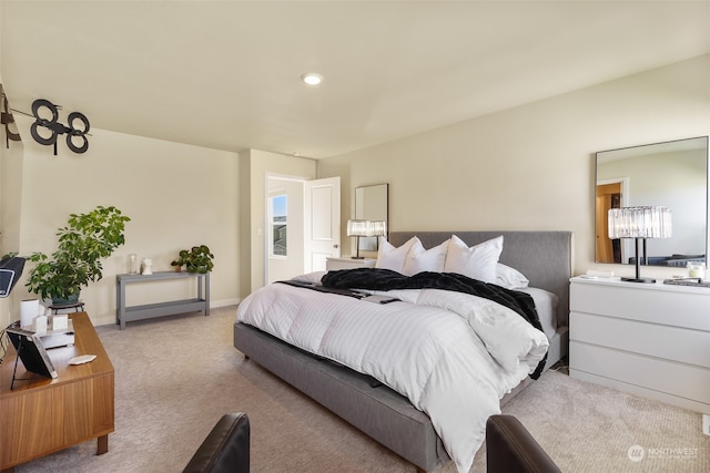 bedroom with light colored carpet