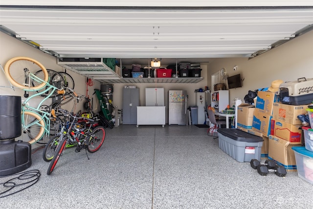 garage with stainless steel refrigerator