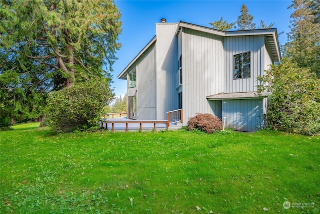 rear view of house with a yard