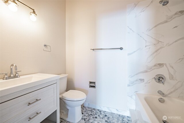 2879 N Nugent Rd Unit H8, Lummi Island, WA 98262 - bathroom featuring toilet, vanity, and shower / bathtub combination