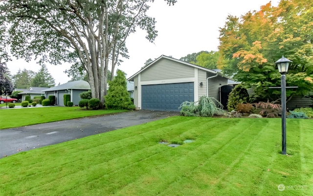 exterior space featuring a front yard and a garage