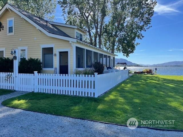 117 Barefoot Ln E, Oroville, WA 98844 - view of property exterior with a sunroom and a water and mountain view