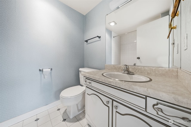 bathroom with vanity, a shower, tile patterned flooring, and toilet