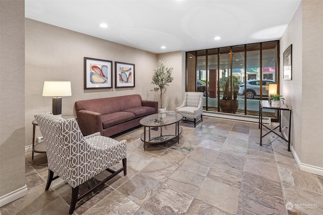 living room featuring floor to ceiling windows