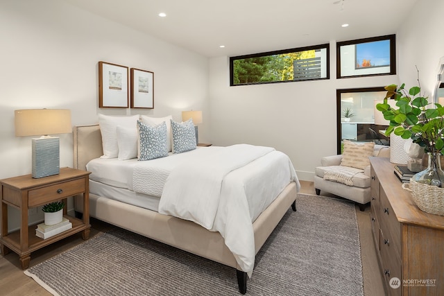 bedroom with hardwood / wood-style flooring