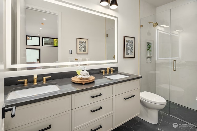 bathroom with tile patterned flooring, vanity, toilet, and a shower with door