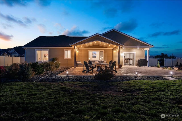 back of house with a patio, a yard, fence, and an outdoor hangout area