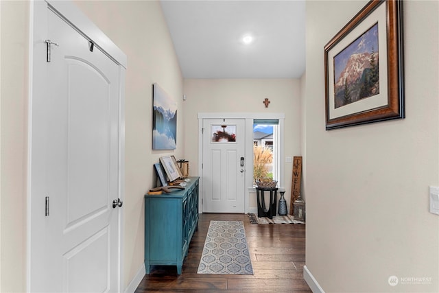 entrance foyer featuring dark wood-style floors and baseboards