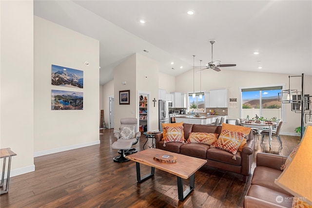 living room featuring baseboards, recessed lighting, dark wood-style flooring, and high vaulted ceiling