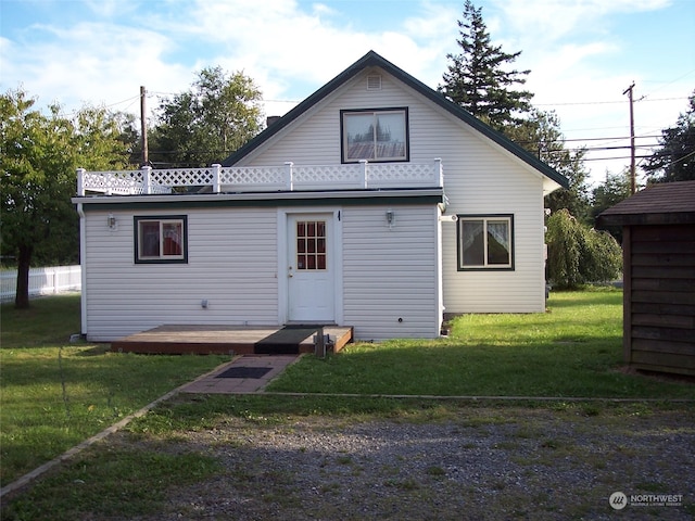 back of house with a yard