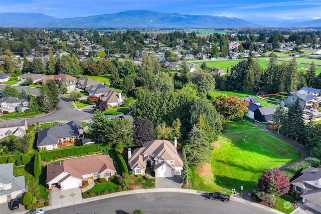 birds eye view of property featuring a mountain view