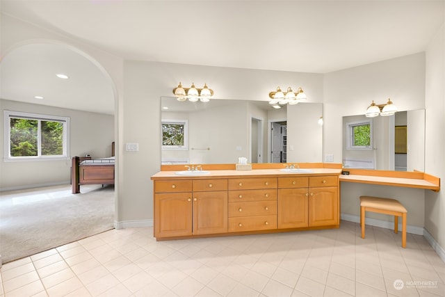 bathroom featuring vanity, tile patterned floors, and a wealth of natural light