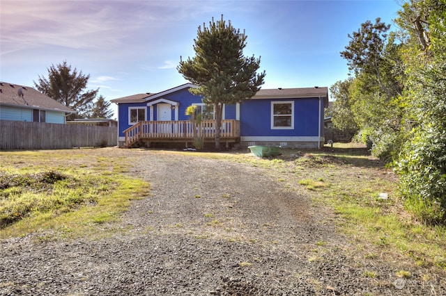 ranch-style home with a deck