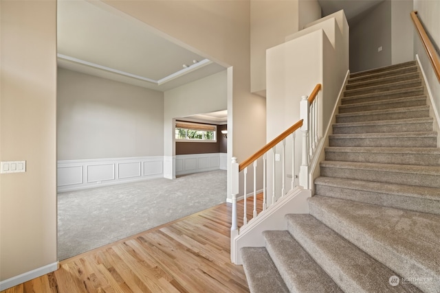 staircase featuring wood-type flooring