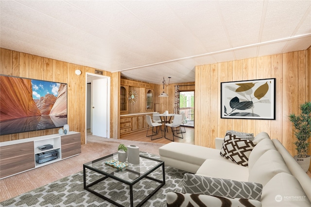 living room with wood-type flooring and wooden walls