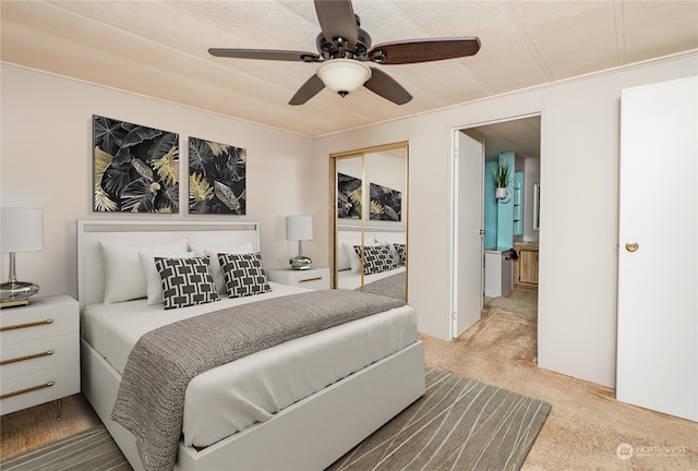 carpeted bedroom featuring ceiling fan