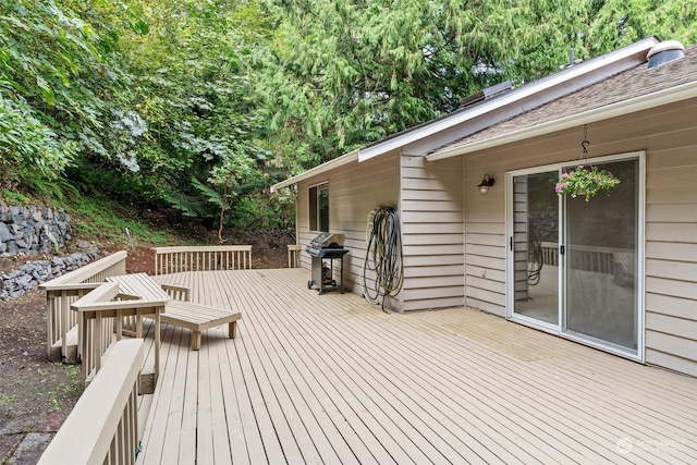 wooden deck with area for grilling