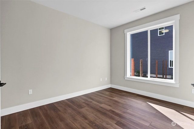 7510 172nd Street Ct E, Puyallup, WA 98375 - empty room featuring baseboards and dark wood finished floors