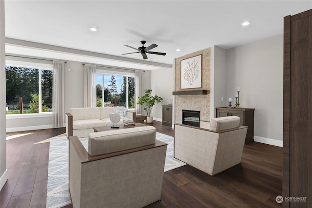 7510 172nd Street Ct E, Puyallup, WA 98375 - living room with a stone fireplace, baseboards, a ceiling fan, recessed lighting, and dark wood-style floors