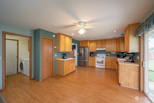 kitchen featuring light wood-type flooring, separate washer and dryer, white electric stove, and stainless steel refrigerator with ice dispenser