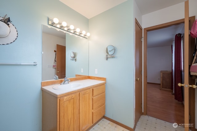 bathroom featuring wood-type flooring and vanity