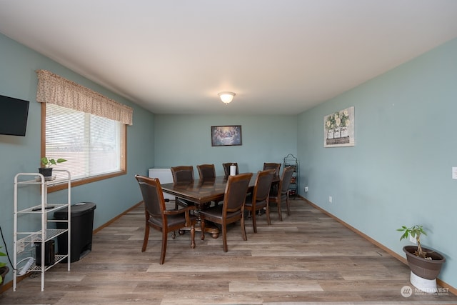 dining area with light wood-type flooring