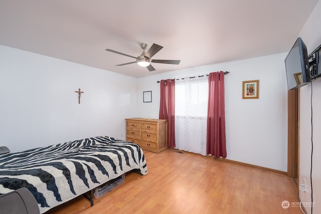 bedroom with ceiling fan and light wood-type flooring