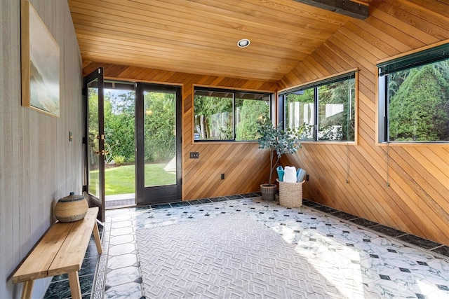 unfurnished sunroom featuring wooden ceiling and lofted ceiling