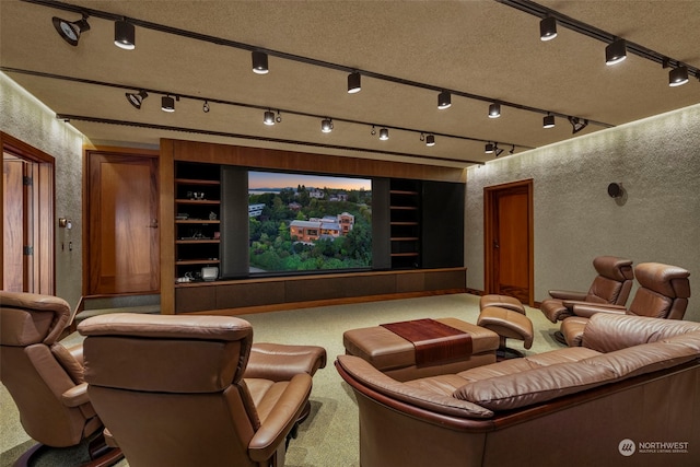 carpeted home theater with a textured ceiling and built in features