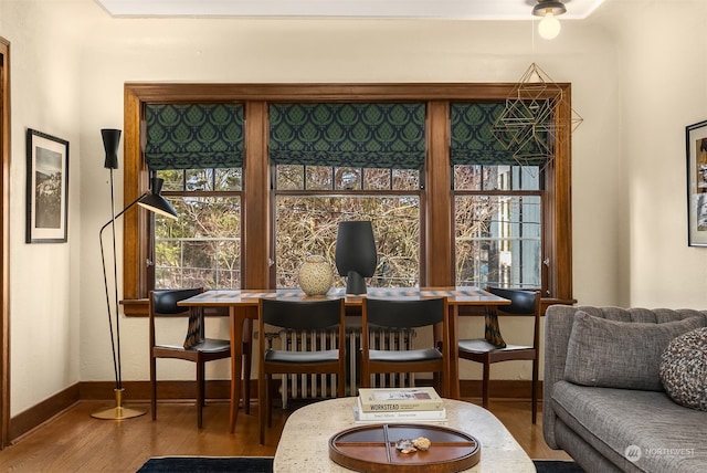 living area with hardwood / wood-style floors