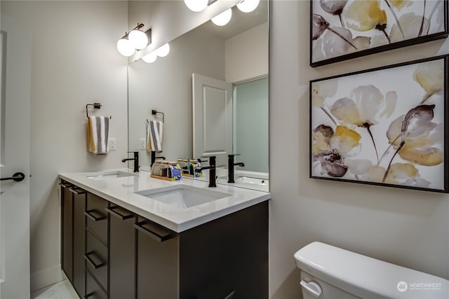 bathroom featuring vanity and toilet