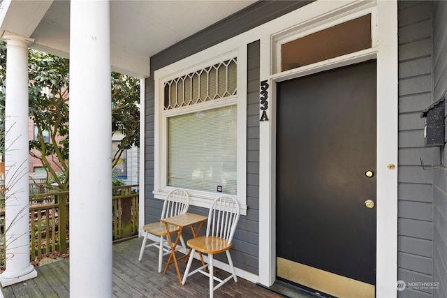 entrance to property featuring a porch