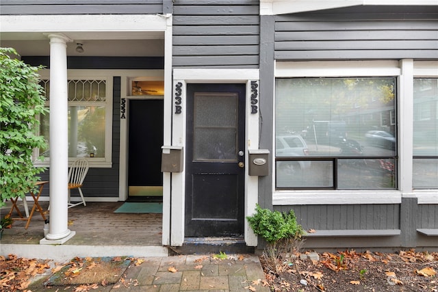 view of exterior entry with covered porch