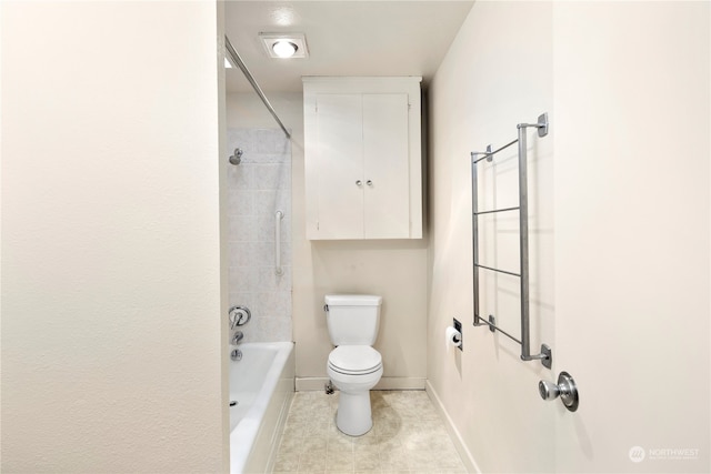 bathroom with tiled shower / bath combo, toilet, and tile patterned flooring