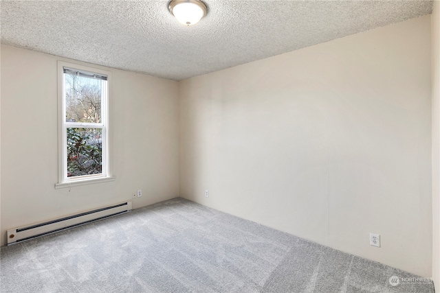 empty room with carpet floors, a baseboard radiator, and a textured ceiling