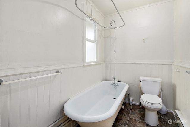 bathroom featuring a baseboard radiator, wood walls, shower / bathing tub combination, and toilet