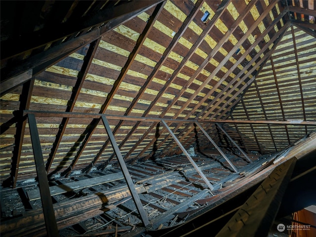 unfinished attic with a healthy amount of sunlight