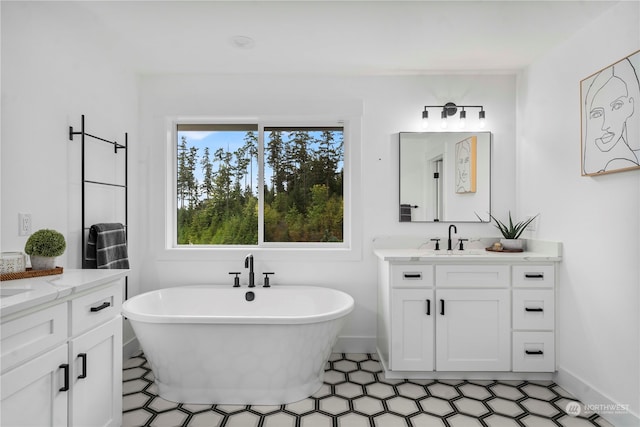 bathroom featuring a tub and vanity