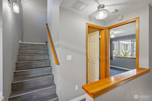 stairway featuring hardwood / wood-style floors