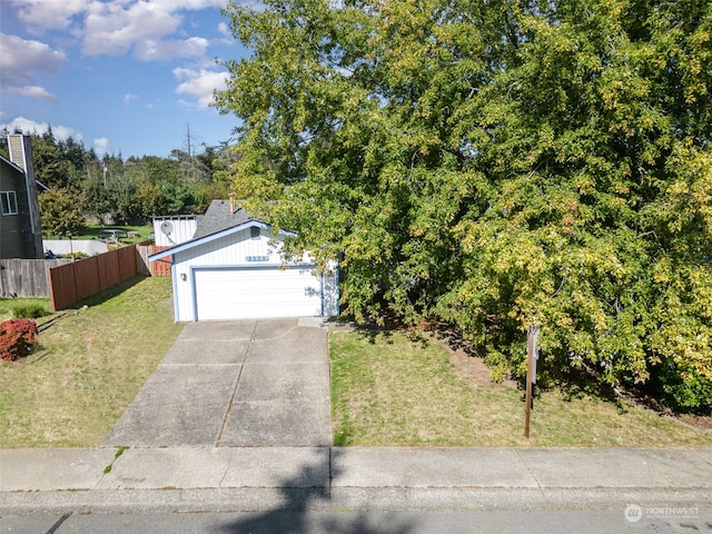 view of front of house with a front lawn and a garage