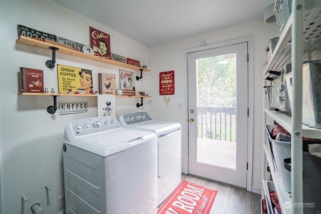 washroom with washer and dryer and hardwood / wood-style flooring