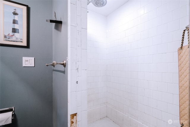 bathroom with a tile shower