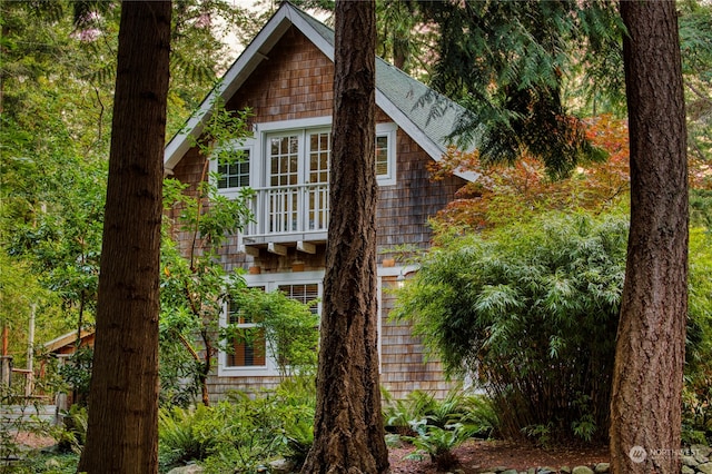 view of side of property featuring a balcony